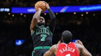 Boston Celtics forward Jaylen Brown (7) shoots during the first half defended by Los Angeles Clippers guard James Harden (1) at TD Garden.