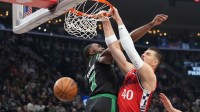 LA Clippers center Ivica Zubac (40) dunks the ball against Boston Celtics guard Jaylen Brown (7) in the first half at Intuit Dome.