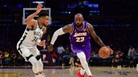 Jan 9, 2026; Los Angeles, California, USA; Los Angeles Lakers forward LeBron James (23) moves the ball against Milwaukee Bucks forward Giannis Antetokounmpo (34) during the second half at Crypto.com Arena. Mandatory Credit: Gary A. Vasquez-Imagn Images