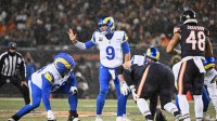 Los Angeles Rams quarterback Matthew Stafford (9) calls the snap count at the line of scrimmage against the Chicago Bears during the first quarter of an NFC Divisional Round game at Soldier Field.