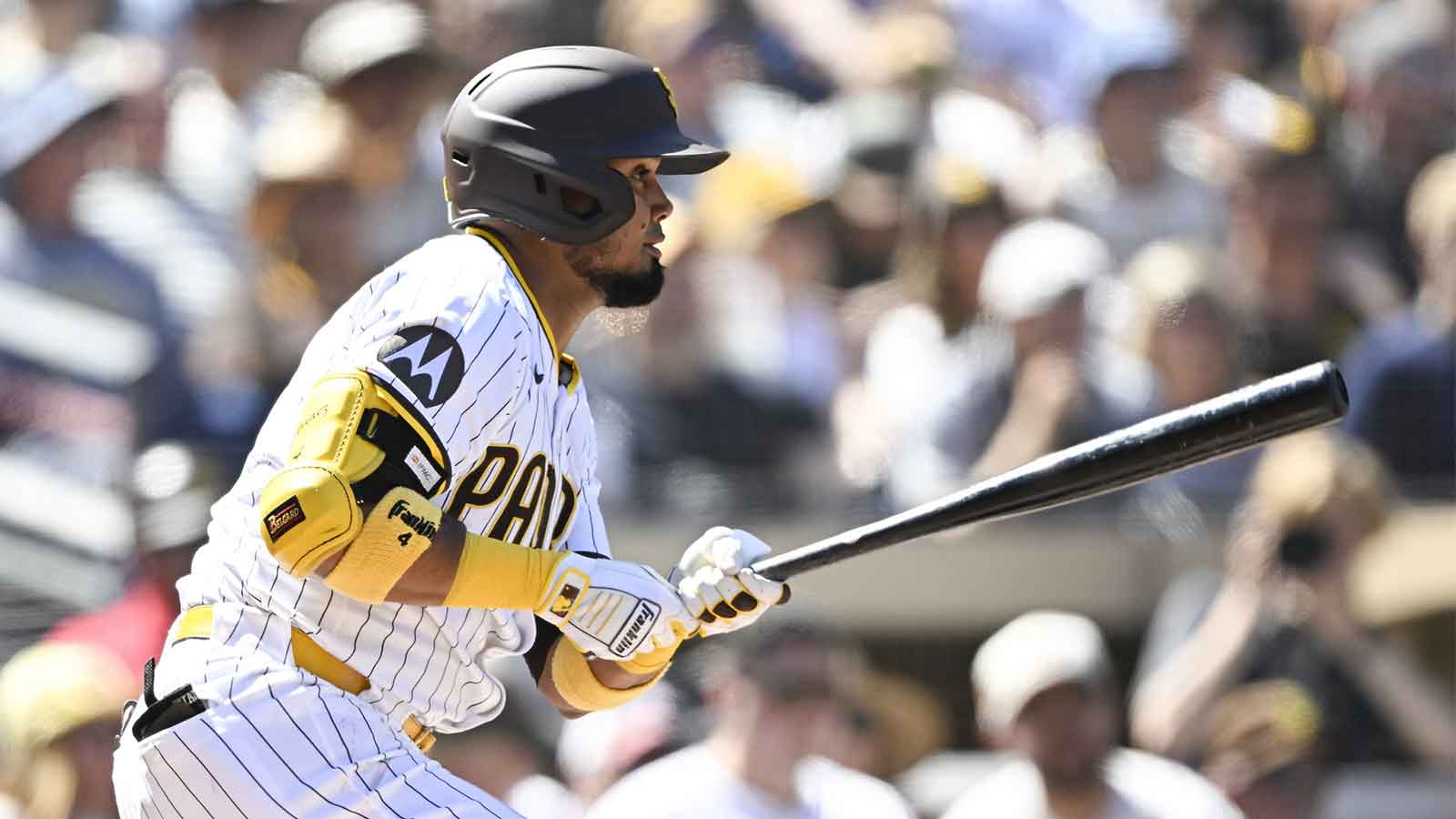 San Diego Padres first baseman Luis Arraez (4) hits a single during the first inning against the Milwaukee Brewers at Petco Park