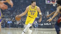 Los Angeles Lakers guard Luka Doncic (77) dribbles the ball in the first quarter against the Cleveland Cavaliers at Rocket Arena.