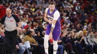 Los Angeles Lakers guard Luka Doncic (77) reacts after scoring against the Chicago Bulls during the first half at United Center.