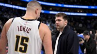 Dallas Mavericks guard Luka Doncic (right) talks with Denver Nuggets center Nikola Jokic (left) after the game at the American Airlines Center.