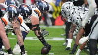 Denver Broncos center Luke Wattenberg (60) prepares to snap the ball against the Las Vegas Raiders during the first half at Allegiant Stadium.
