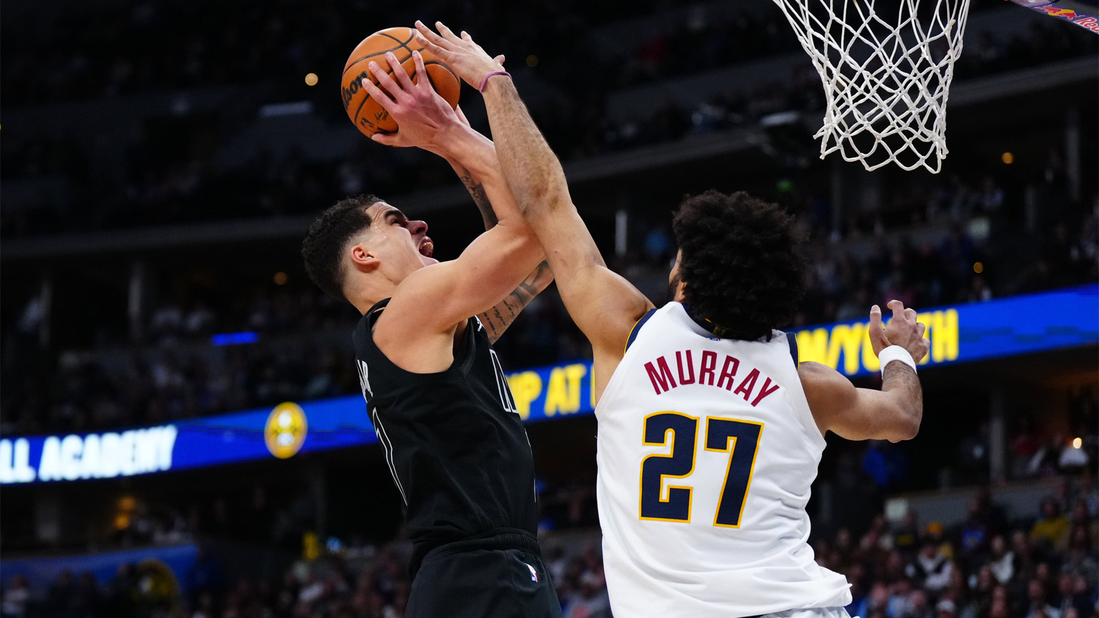 Brooklyn Nets forward Michael Porter Jr. (17) shoots the ball over Denver Nuggets guard Jamal Murray (27) in the second half at Ball Arena.