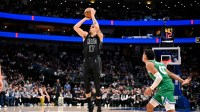 Jan 12, 2026; Dallas, Texas, USA; Brooklyn Nets forward Michael Porter Jr. (17) makes a three point shot against the Dallas Mavericks during the second half at the American Airlines Center. Mandatory Credit: Jerome Miron-Imagn Images