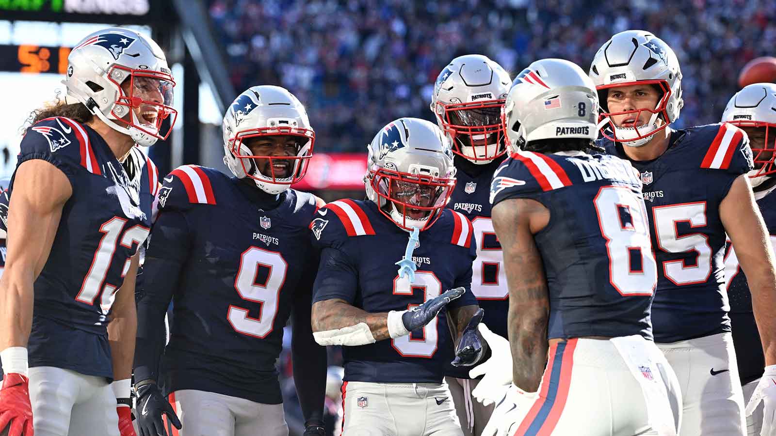 New England Patriots wide receiver Mack Hollins (13), wide receiver Kayshon Boutte (9), wide receiver DeMario Douglas (3), offensive tackle Morgan Moses (76), and tight end Hunter Henry (85) come together to celebrate wide receiver Stefon Diggs (8) touchdown during the first half against the Atlanta Falcons at Gillette Stadium.