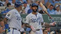Kansas City Royals third baseman Maikel Garcia (11) talks with teammate first baseman Salvador Perez (13) in the on deck circle in the fifth inning against the Pittsburgh Pirates at Kauffman Stadium.