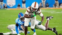 Miami Hurricanes wide receiver Malachi Toney (10) carries the ball against the Mississippi Rebels in the first half during the Verb Fiesta Bowl and CFP semifinal game at State Farm Stadium on Jan. 8, 2026, in Glendale.