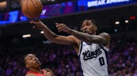 Sacramento Kings guard Malik Monk (0) passes the ball against the Toronto Raptors during the second quarter at Golden 1 Center.