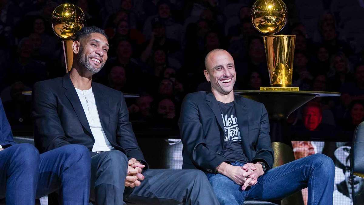 Former San Antonio Spurs greats Tim Duncan and Manu Ginobili laugh during Tony Parker's retirement ceremony at the AT&T Center.