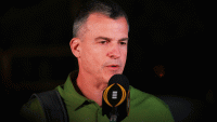 Miami Hurricanes head coach Mario Cristobal speaks to reporters after arriving at the Fontainebleau Miami Beach ahead of the College Football Playoff National Championship game against the Indiana Hoosiers.
