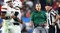Miami Hurricanes head coach Mario Cristobal reacts in the second half during the 2026 Fiesta Bowl and semifinal game of the College Football Playoff at State Farm Stadium.