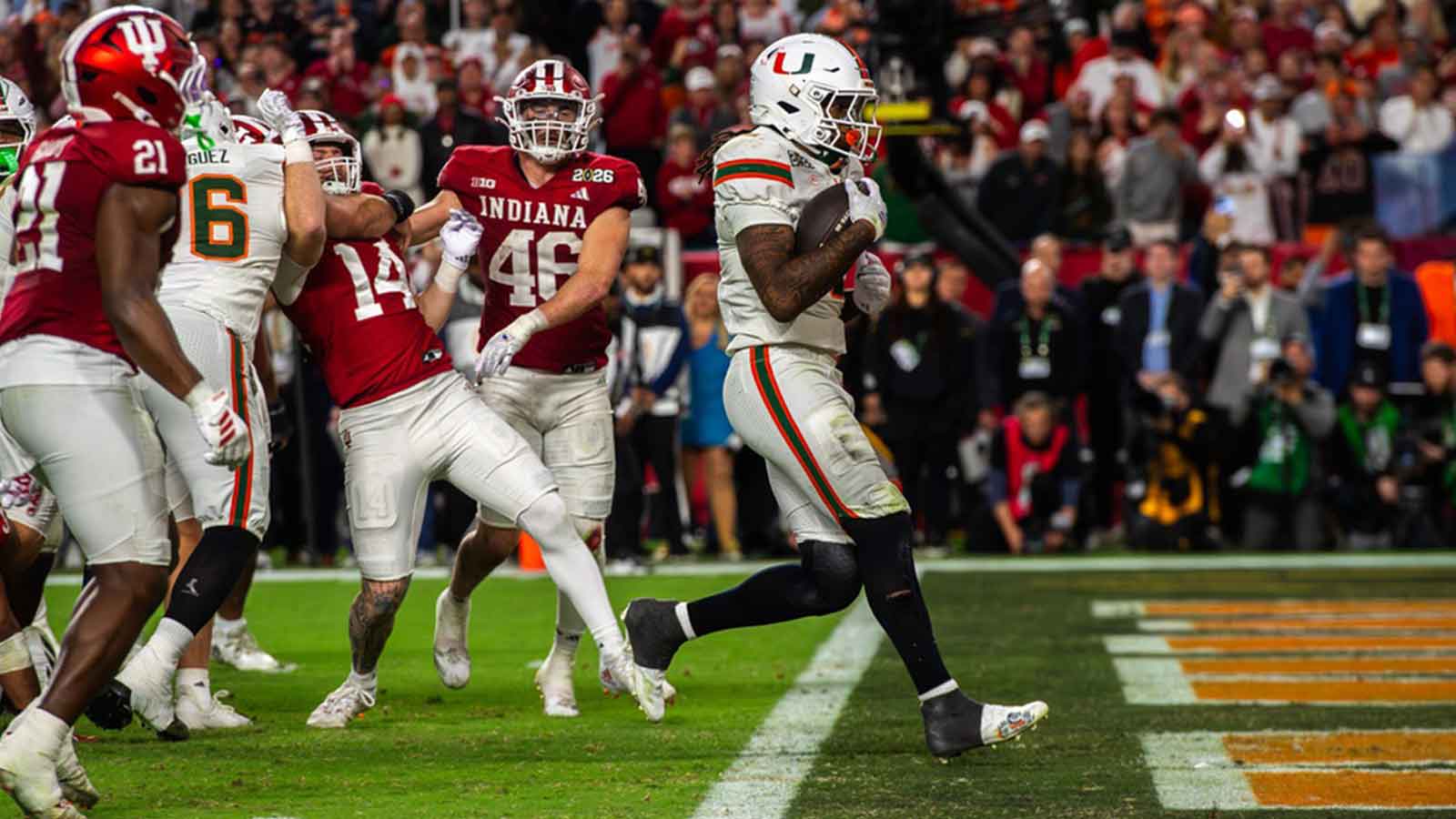 Miami's Mark Fletcher Jr. (4) scores a touchdown during the College Football Playoff National Championship college football game at Hard Rock Stadium in Miami Gardens on Monday, Jan. 19, 2026.