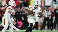 Miami Hurricanes running back Mark Fletcher Jr. (4) runs with the ball against the Indiana Hoosiers during the first half of the College Football Playoff National Championship game at Hard Rock Stadium.