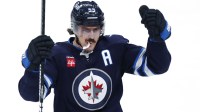 Winnipeg Jets center Mark Scheifele (55) celebrates a goal against the Minnesota Wild in the second period at Canada Life Centre.