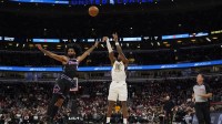 Indiana Pacers guard Bennedict Mathurin (00) shoots the ball over Chicago Bulls forward Coby White (00 during the first half at United Center.