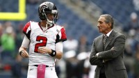 Atlanta Falcons quarterback Matt Ryan (2) talks with Atlanta Falcons owner Arthur Blank, right, during pregame warmups against the Seattle Seahawks at CenturyLink Field.