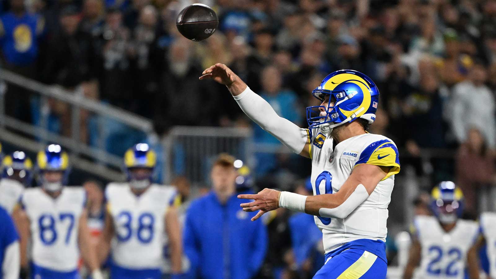Los Angeles Rams quarterback Matthew Stafford (9) drops back to pass against the Carolina Panthers in the first half during the NFC Wild Card Round game at Bank of America Stadium.
