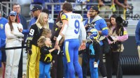 Matthew and Kelly Stafford with their kids before the Los Angeles Rams' game against the Arizona Cardinals.