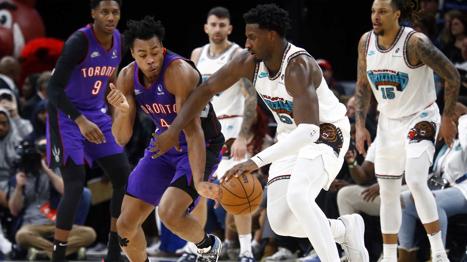 Grizzlies forward Jaren Jackson Jr. (13) dribbles as Toronto Raptors forward Scottie Barnes (4) defends during the fourth quarter at FedExForum