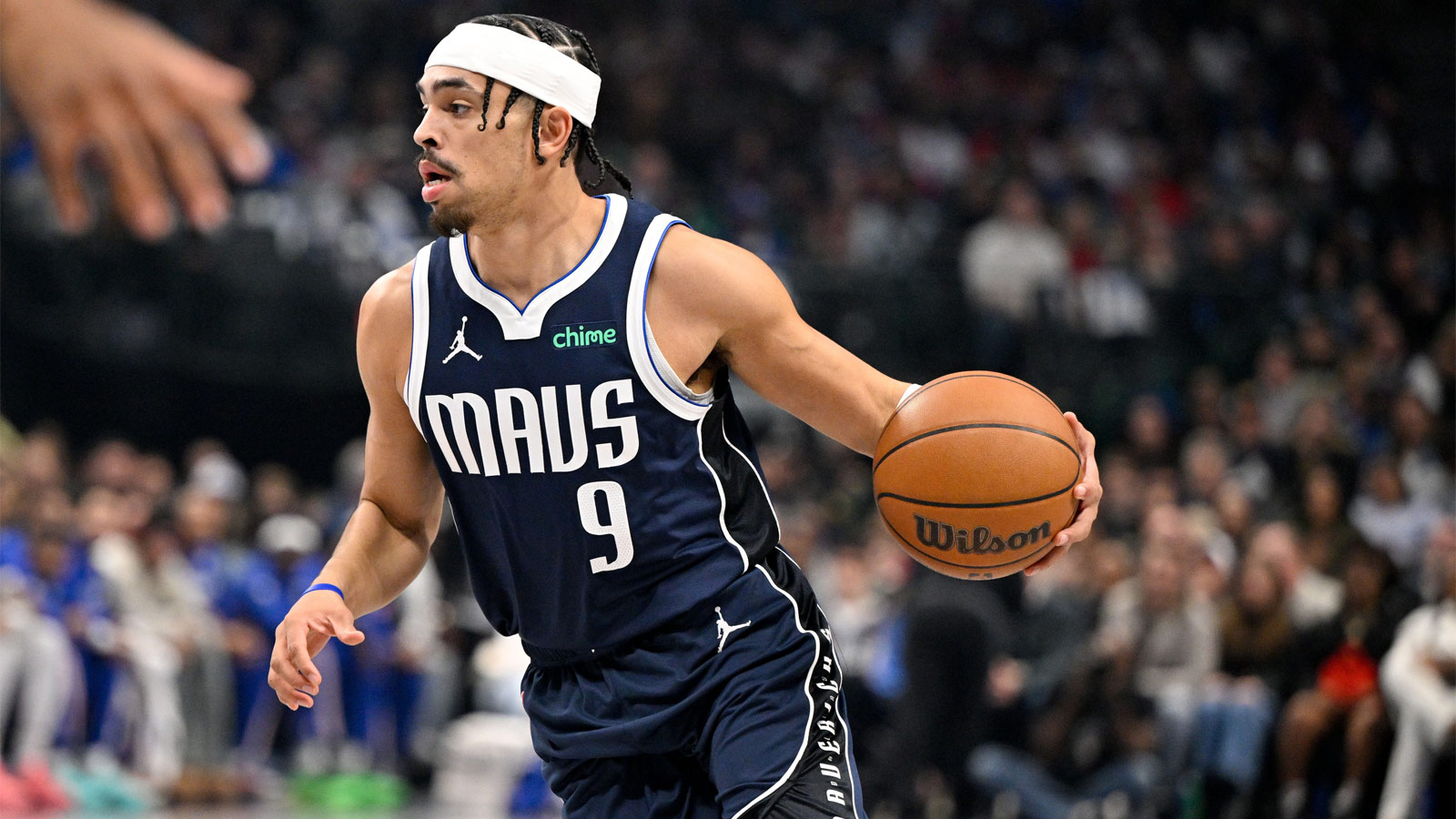 Mavericks guard Ryan Nembhard (9) brings the ball up court during the first quarter against the Philadelphia 76ers at the American Airlines Center