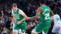 Dallas Mavericks forward Cooper Flagg (32) reacts after scoring against the Charlotte Hornets during the first quarter at American Airlines Center.