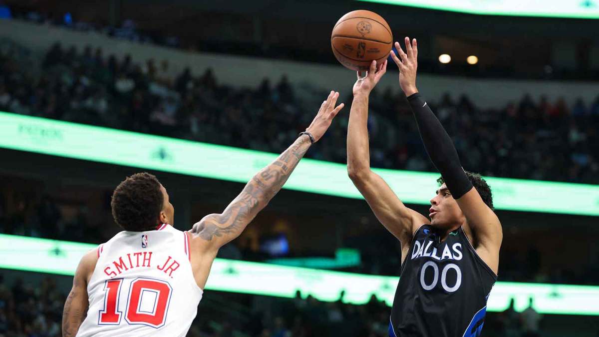 Dallas Mavericks guard Max Christie (00) shoots over Houston Rockets forward Jabari Smith Jr. (10) during the second half at American Airlines Center.