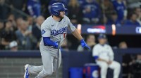 Los Angeles Dodgers third baseman Max Muncy (13) hits a single against the Toronto Blue Jays in the tenth inning during game seven of the 2025 MLB World Series at Rogers Centre.