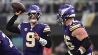 Minnesota Vikings quarterback J.J. McCarthy (9) throws a pass against the Green Bay Packers during the first quarter at U.S. Bank Stadium.