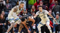 Atlanta Hawks guard CJ McCollum (3) looses the ball against Milwaukee Bucks guard Amir Coffey (17) and Milwaukee Bucks guard Ryan Rollins (13) during the fourth quarter at State Farm Arena
