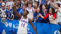 Kansas Jayhawks guard Melvin Council Jr. (14) celebrates with fans after defeating the Iowa State Cyclones at Allen Fieldhouse.