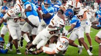 Miami Hurricanes running back CharMar Brown (6) scores a touchdown against the Mississippi Rebels in the first half during the Vrbo Fiesta Bowl and CFP semifinal game at State Farm Stadium on Jan. 8, 2026, in Glendale. © Rob Schumacher/The Republic / USA TODAY NETWORK via Imagn Images
