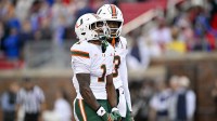 Miami Hurricanes wide receiver Joshisa Trader (1) and wide receiver Joshua Moore (3) celebrates a touchdown against the SMU Mustangs during the first quarter at Gerald J. Ford Stadium.