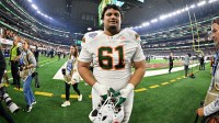 Miami Hurricanes offensive lineman Francis Mauigoa (61) walks off the field after the 2025 Cotton Bowl and quarterfinal game of the College Football Playoff at AT&T Stadium.