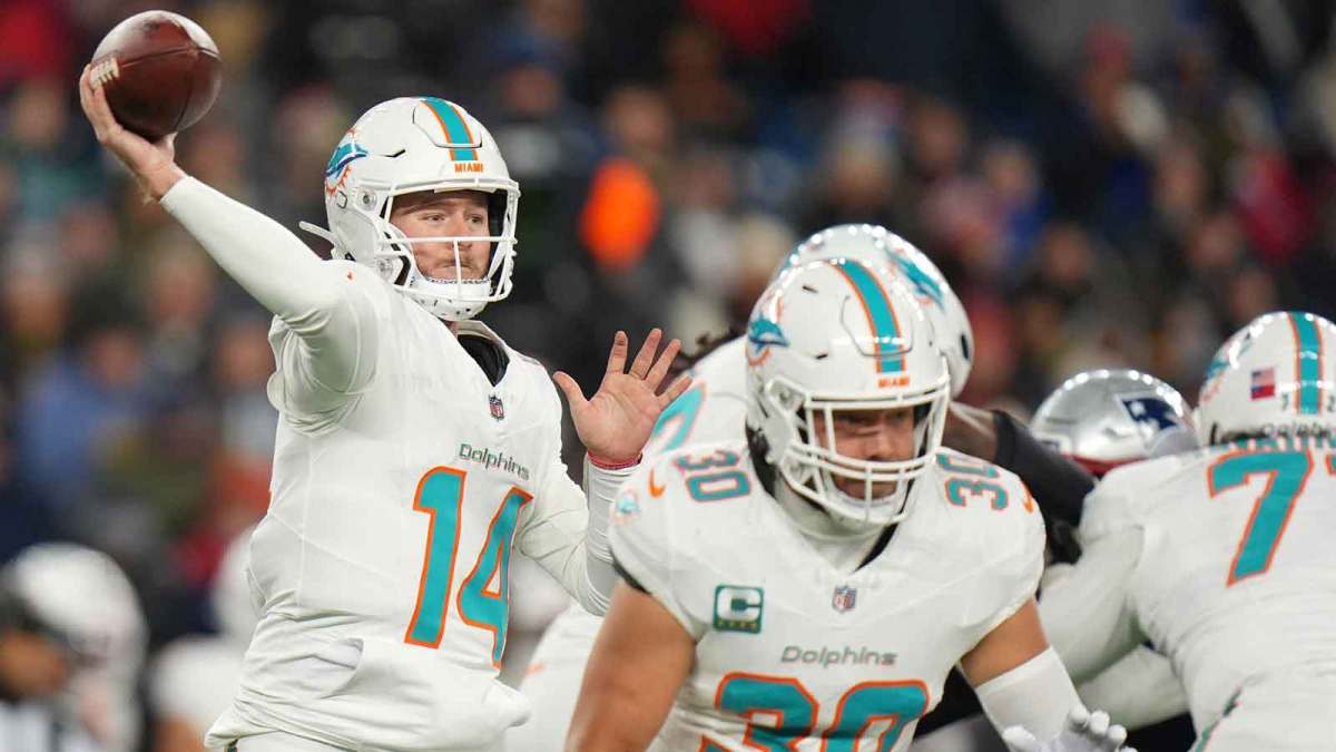 New England Patriots linebacker Robert Spillane (14) throws a pass and fullback Alec Ingold (30) blocks against the New England Patriots during the second half at Gillette Stadium.