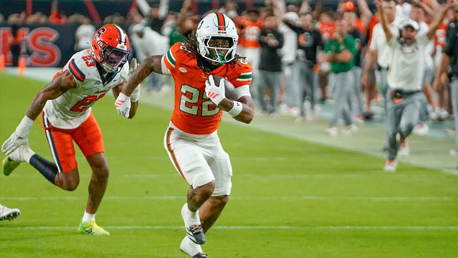 Miami Hurricanes running back Girard Pringle Jr. (22) rushes for a touchdown against the Syracuse Orange during the third quarter at Hard Rock Stadium.