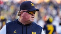 Michigan defensive coordinator Wink Martindale watches warm up ahead of the New Mexico game at Michigan Stadium in Ann Arbor on Saturday, August 30, 2025.