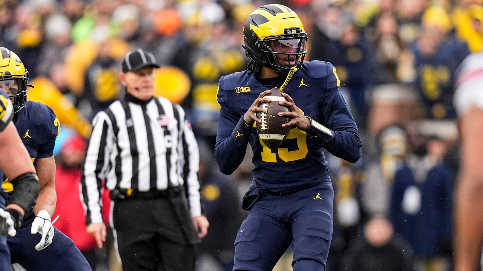 Michigan quarterback Bryce Underwood (19) looks to pass against Ohio State during the first half at Michigan Stadium in Ann Arbor on Saturday, Nov. 29, 2025.