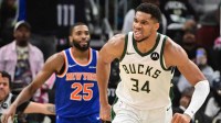 Milwaukee Bucks forward Giannis Antetokounmpo (34) reacts after scoring a basket in the 3rd quarter as New York Knicks guard Mikal Bridges (25) looks on at Fiserv Forum.