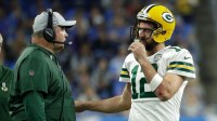 Coach Mike McCarthy talks with Green Bay Packers quarterback Aaron Rodgers (12) during a second half break during the Green Bay Packers 31-23 loss to the Detroit Lions at Ford Field, Detroit, Sunday, October 7, 2018.