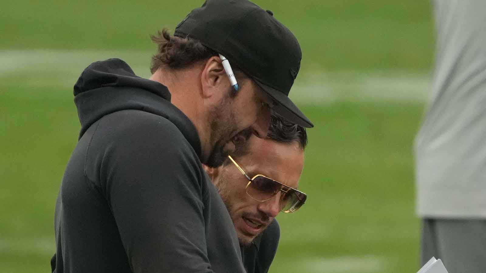 Miami Dolphins offensive coordinator Frank Smith (left) and coach Mike McDaniel during practice at the PSD Bank Arena.