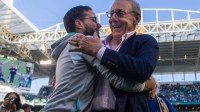 Miami Dolphins head coach Mike McDaniel embraces Dolphins owner Stephen Ross after the Dolphins beat the New York Jets at Hard Rock Stadium on Sunday, January 8, 2023, in Miami Gardens, FL.