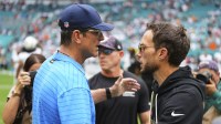 Los Angeles Chargers head coach Jim Harbaugh greats Miami Dolphins Mike McDaniel at the game at Hard Rock Stadium