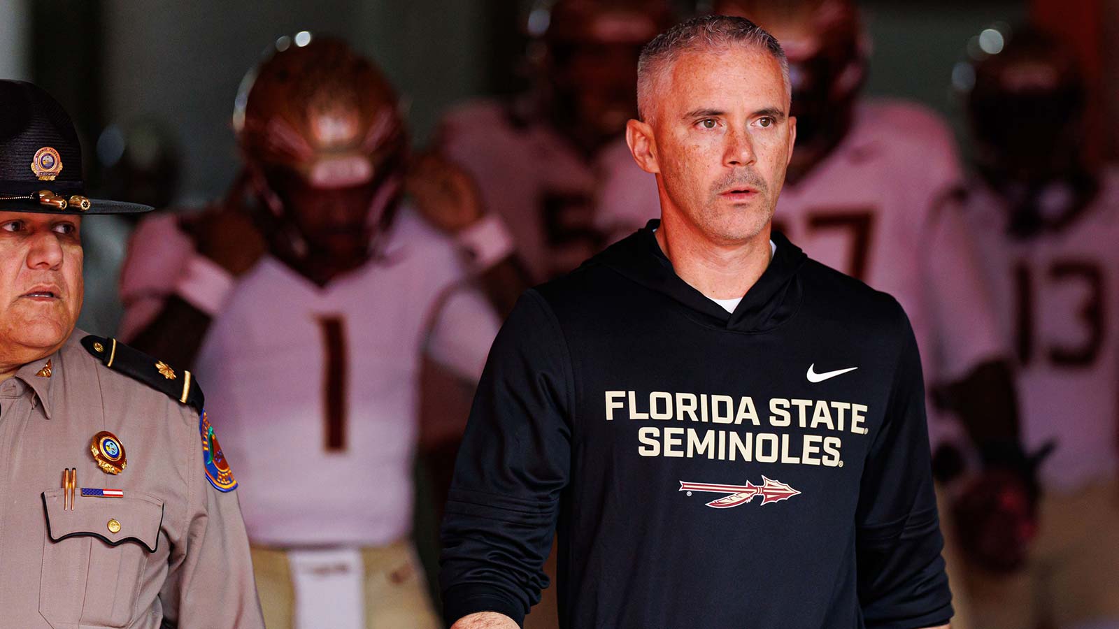 Florida State Seminoles head coach Mike Norvell walks out of the tunnel before a game against the Florida Gators at Ben Hill Griffin Stadium.