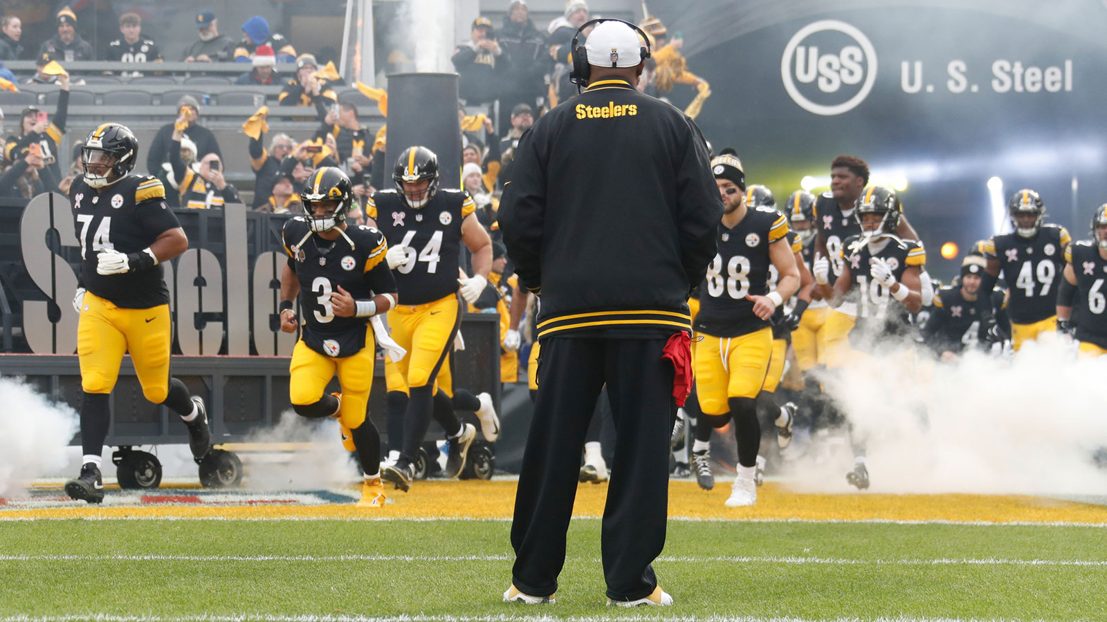 he Pittsburgh Steelers take the field as head coach Mike Tomlin (middle) looks on before the game against the Kansas City Chiefs at Acrisure Stadium.