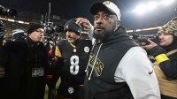 Pittsburgh Steelers head coach Mike Tomlin and quarterback Aaron Rodgers (8) celebrate after defeating the Baltimore Ravens at Acrisure Stadium