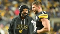 Pittsburgh Steelers head coach Mike Tomlin speaks with Pittsburgh Steelers linebacker T.J. Watt (90) during the second quarter against the Buffalo Bills at Acrisure Stadium.