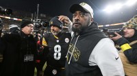 Pittsburgh Steelers head coach Mike Tomlin and quarterback Aaron Rodgers (8) celebrate after defeating the Baltimore Ravens at Acrisure Stadium.
